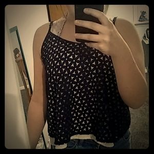 Blue blouse with flowers on it.